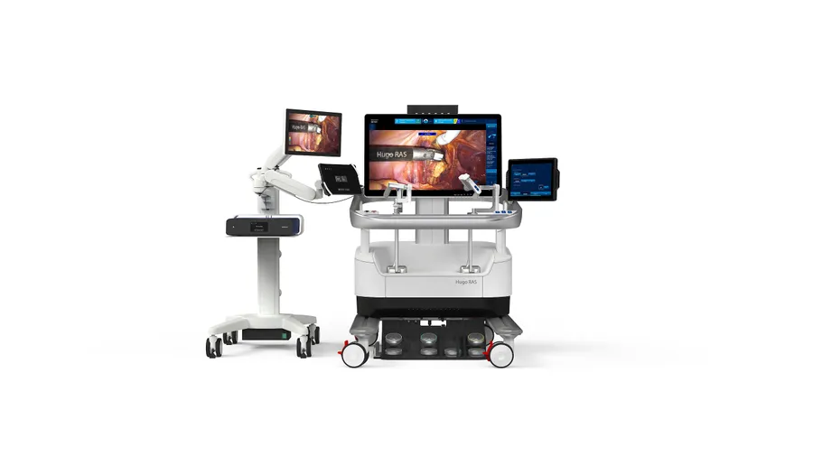 Hugo RAS surgeon console next to a cart carrying the Touch Surgery Aide and its adjunct monitor